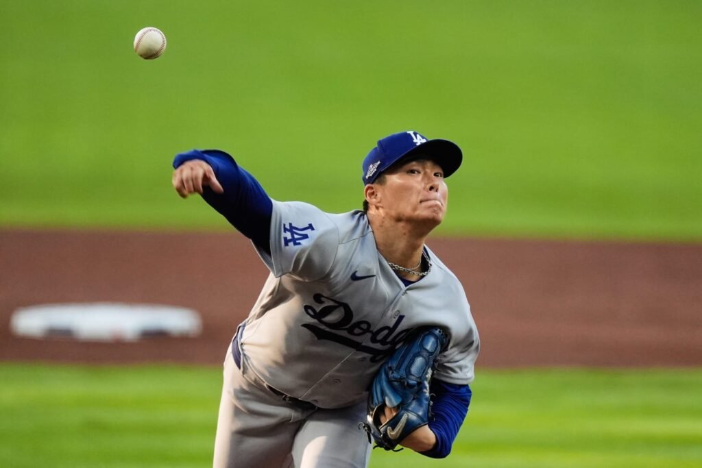 Yoshinobu Yamamoto pitching against Atlanta at Truist Park in NLDS Game 3