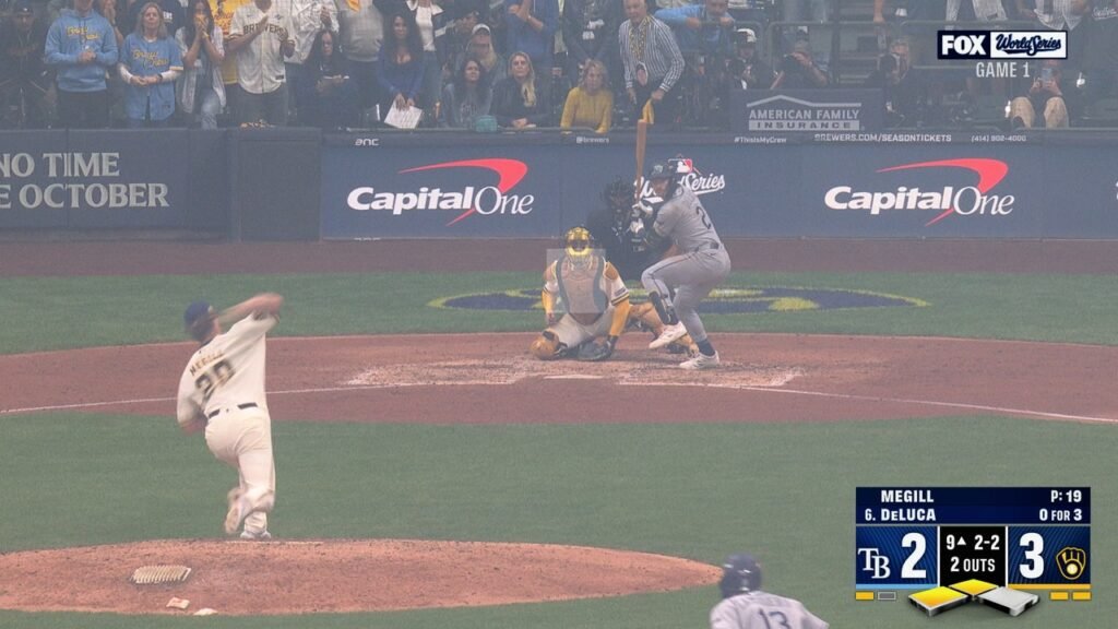 Trevor Megill pitches to Jonny DeLuca during the ninth inning of World Series Game 1.
