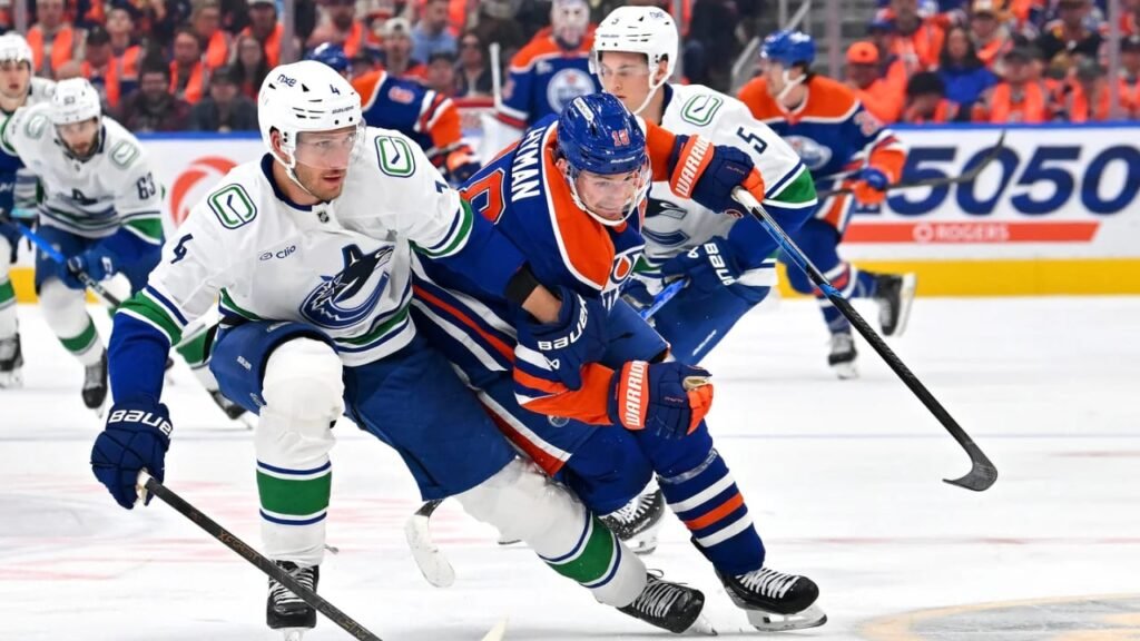 Zach Hyman battles for position against Vancouver during Edmonton’s September 29, 2026 game at Rogers Place.